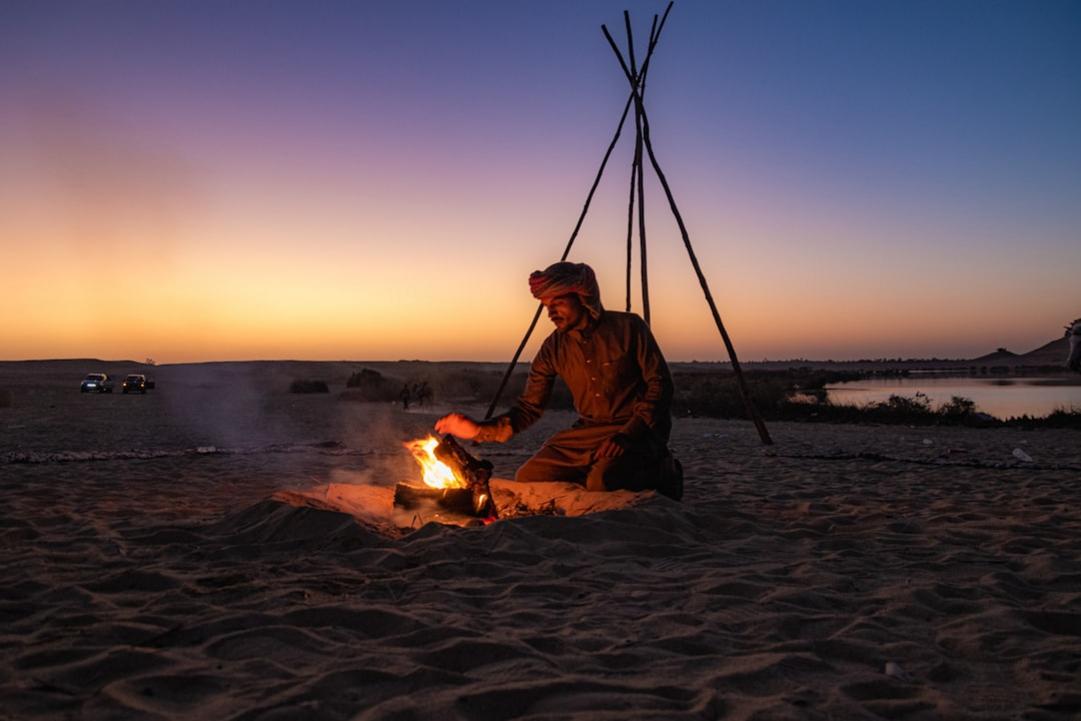Jordan Petra treasury Man by a campfire