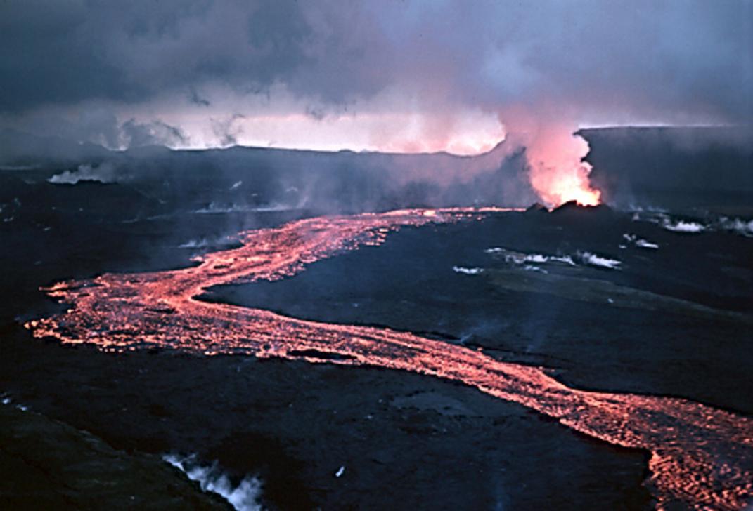 The steam rises from the vibrant blue Viti crater lake, inviting you to explore its shores.
